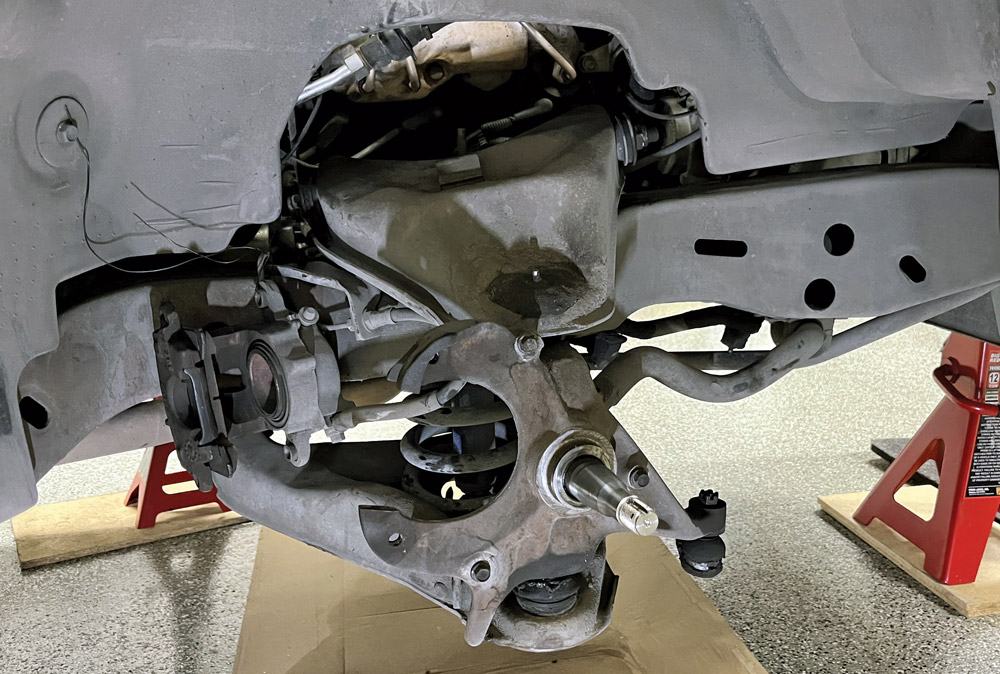 closeup of spindle after disassembling the front brakes and suspension