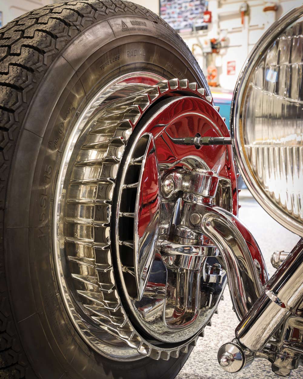 Close-up of a highly polished chrome front wheel on a 1932 Ford Roadster