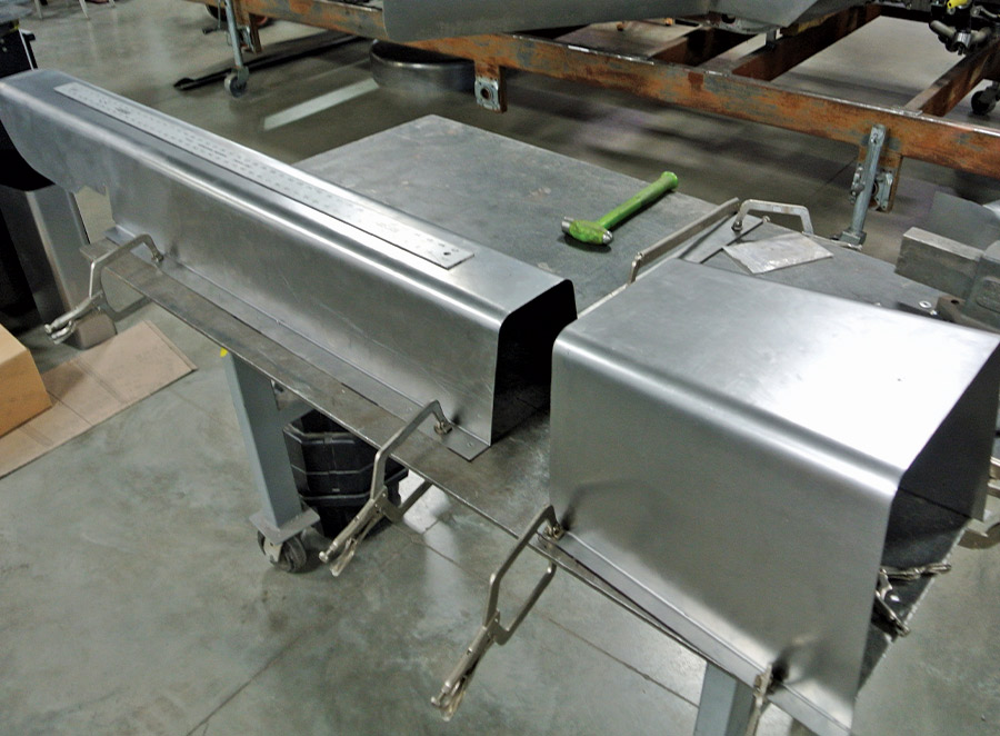 The transmission cover and driveshaft housing were made in sections. The nicely radiused bends give them a very smooth appearance