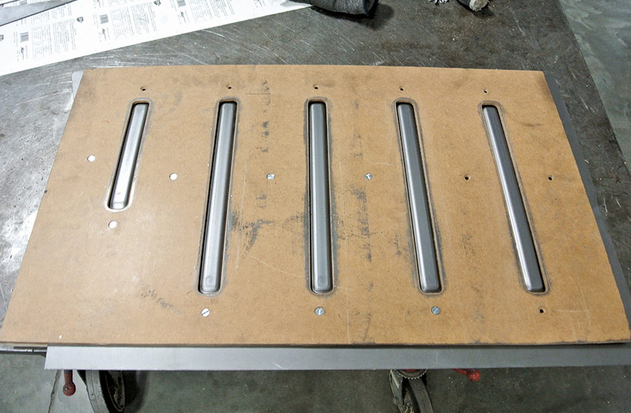 This is how the part appears after the forming is completed before removing the plywood guide