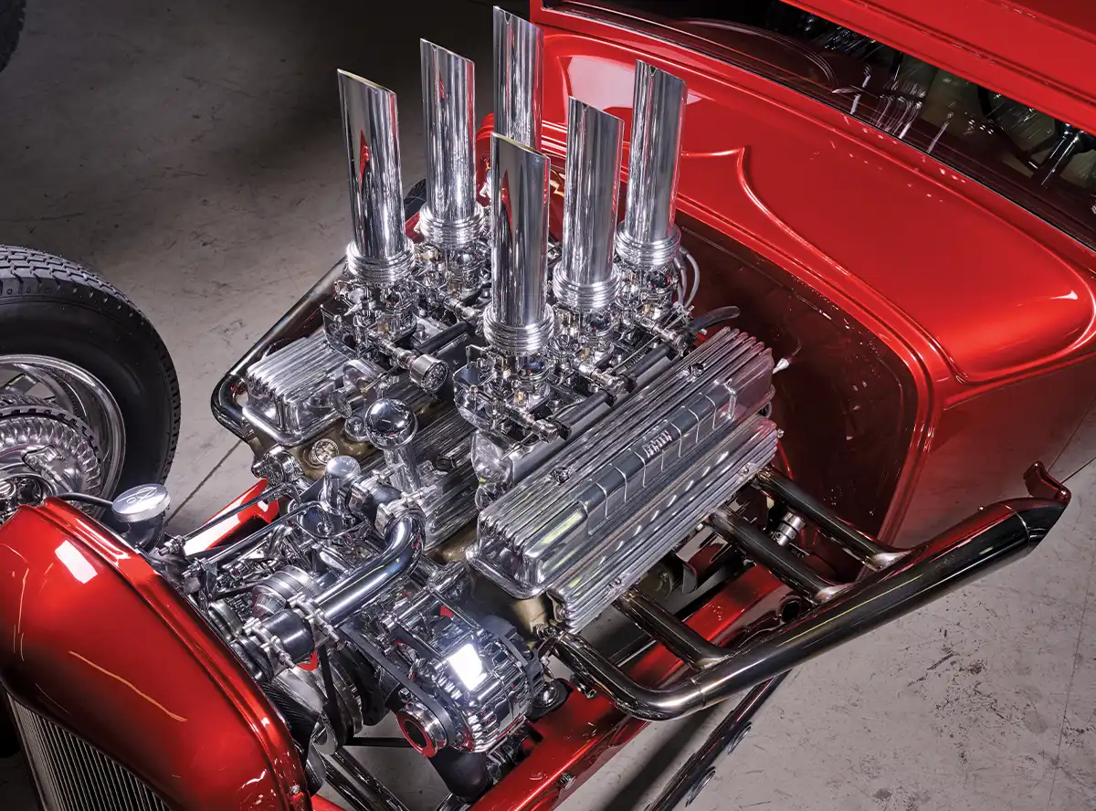 Close-up of the 1930 Ford Model A Hot Rod’s engine bay, focusing on the gleaming chrome components and intricate detailing