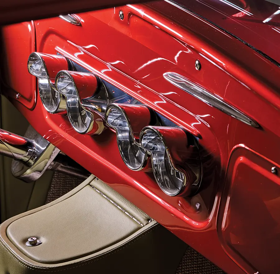 Custom chrome gauge cluster on the dashboard of a 1930 Ford Sedan