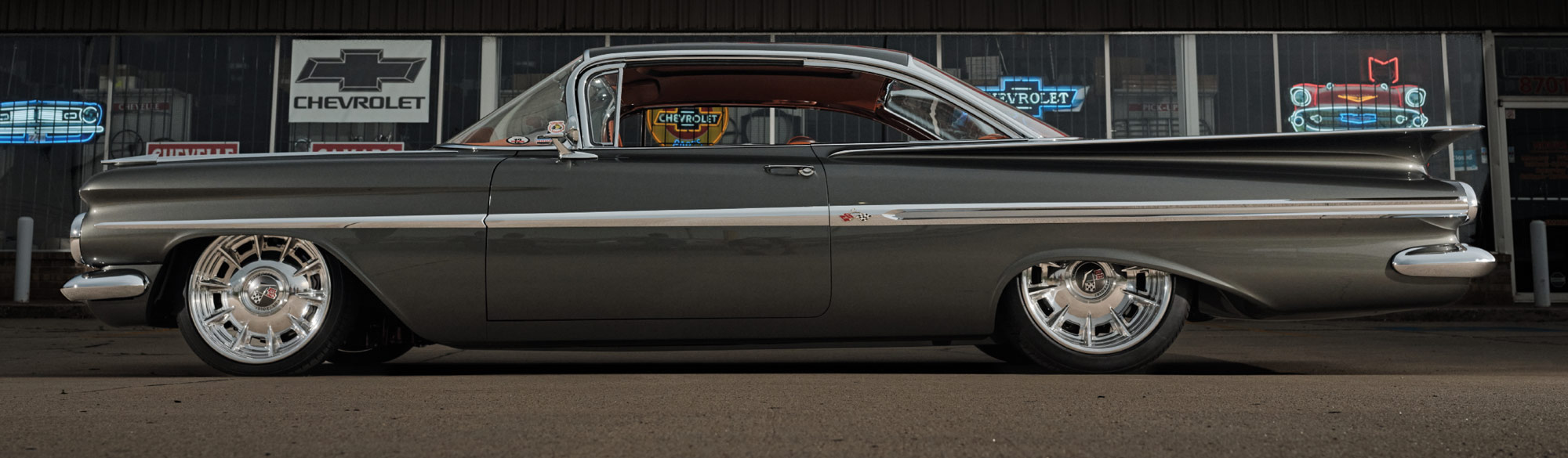 1959 Chevrolet Impala with a sleek custom paint job and polished chrome wheels