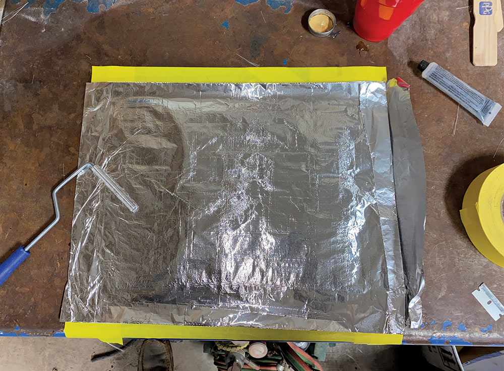aluminum foil laid over curing fiberglass 