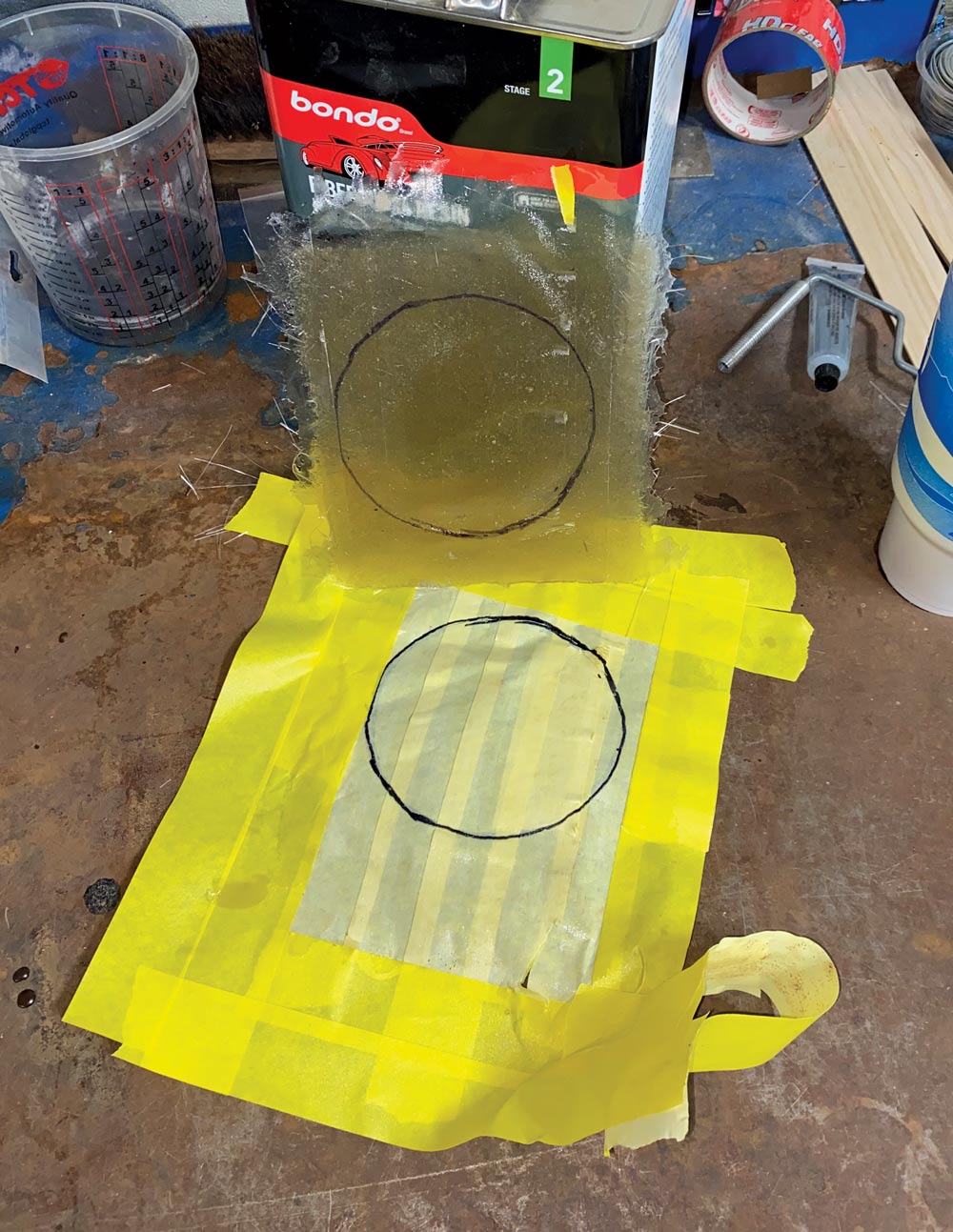 fiberglass with circle of engine compartment hole traced on it 
