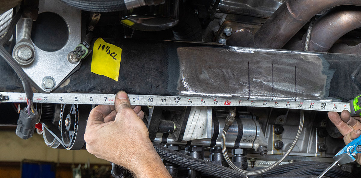Measuring the crossmember for fitting in the custom chassis of the 1955 Chevrolet Bel Air gasser