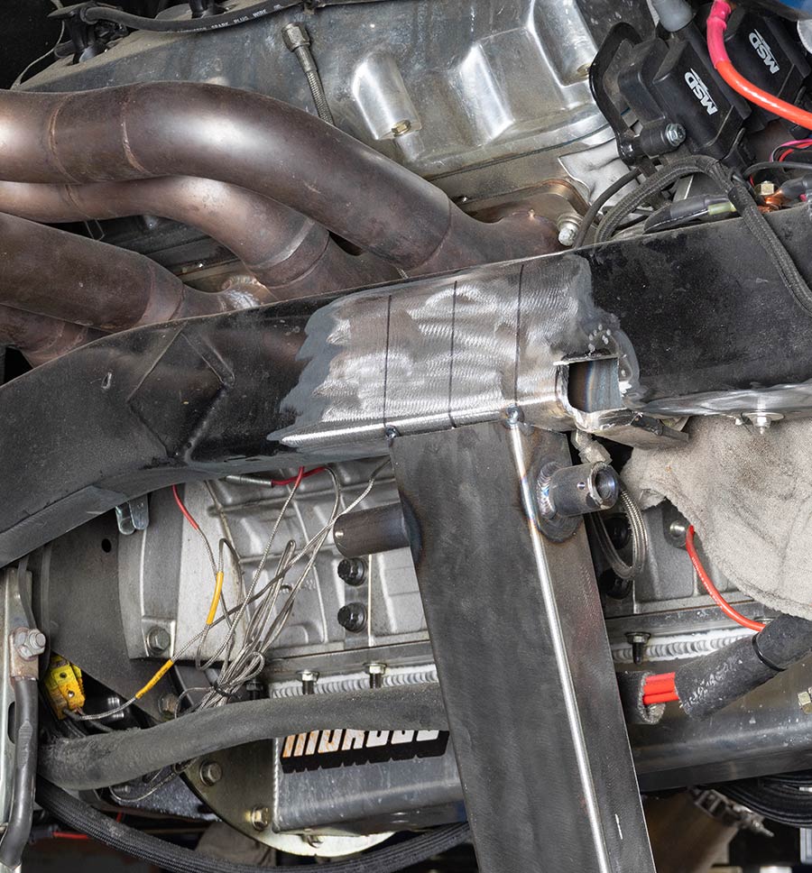 Close-up of the engine bay and custom tubular frame setup on the 1955 Chevrolet Bel Air gasser project