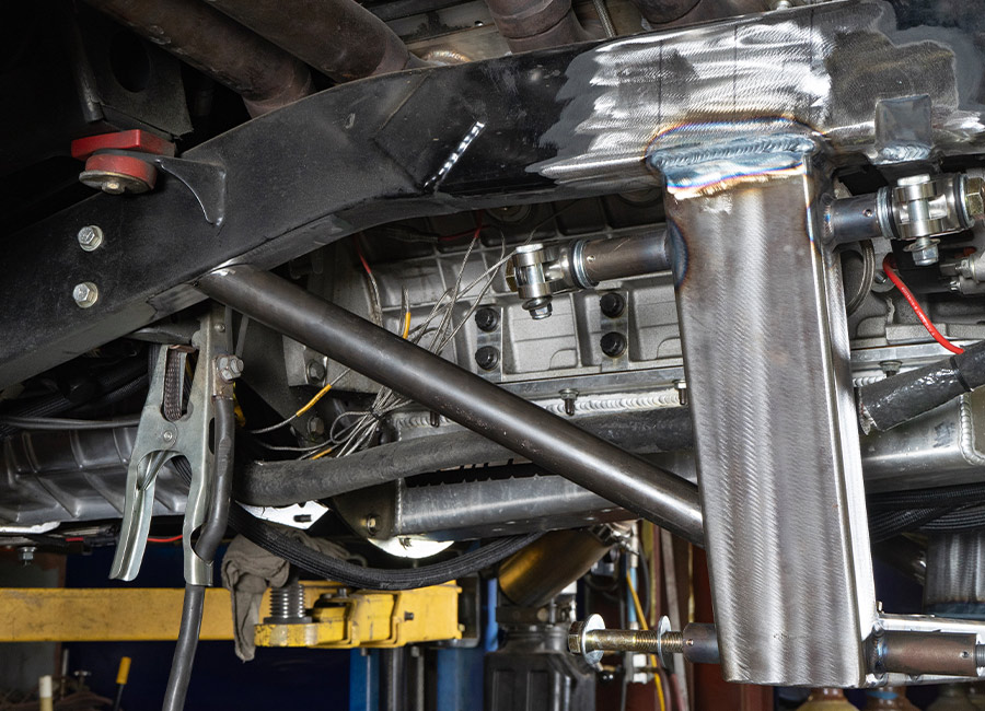 Chassis detail showing a reinforced crossmember in the 1955 Chevrolet Bel Air gasser’s front end