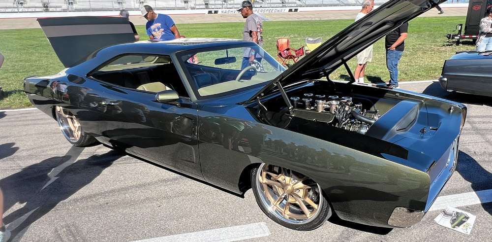 dark gray car at a car show