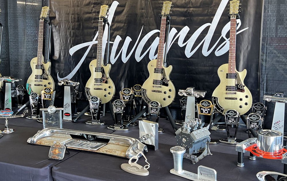 table with guitars and trophies