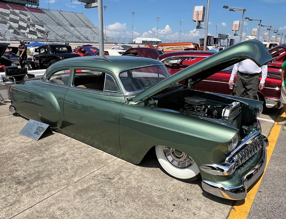 green car at a car show
