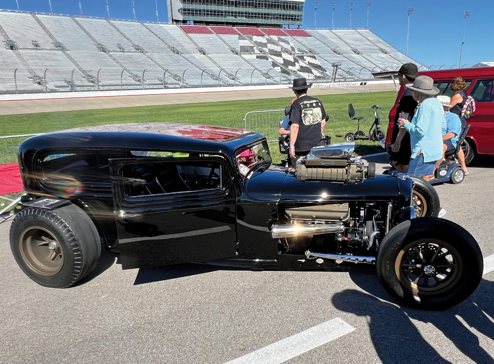 black car at a car show