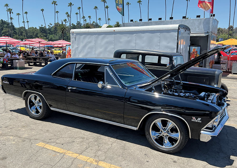 A black 1966 Chevrolet Chevelle SS with polished chrome wheels
