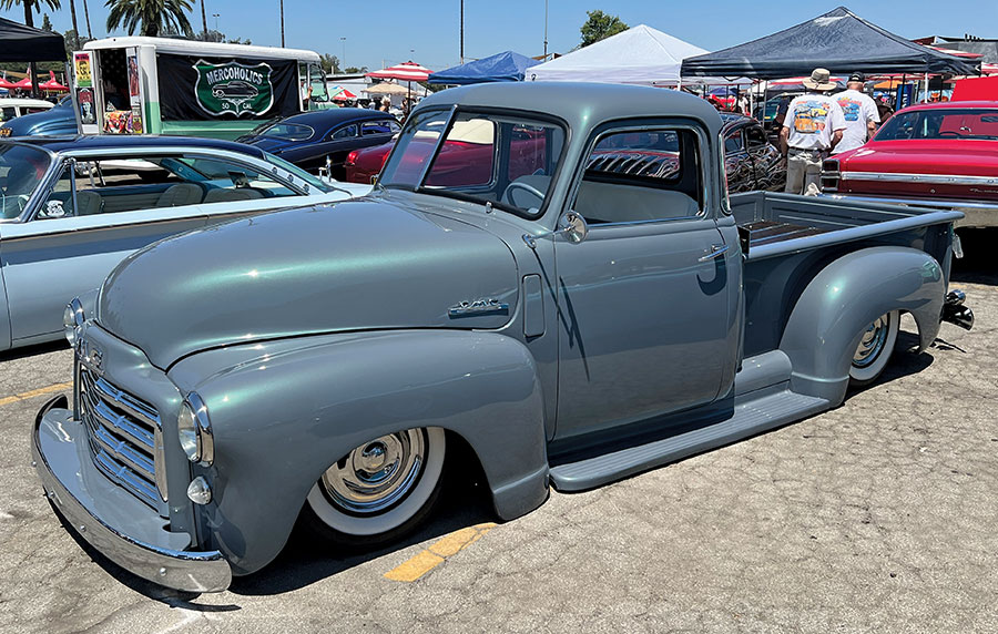 custom 1953 GMC pickup truck with lowered suspension and a sleek gray finish