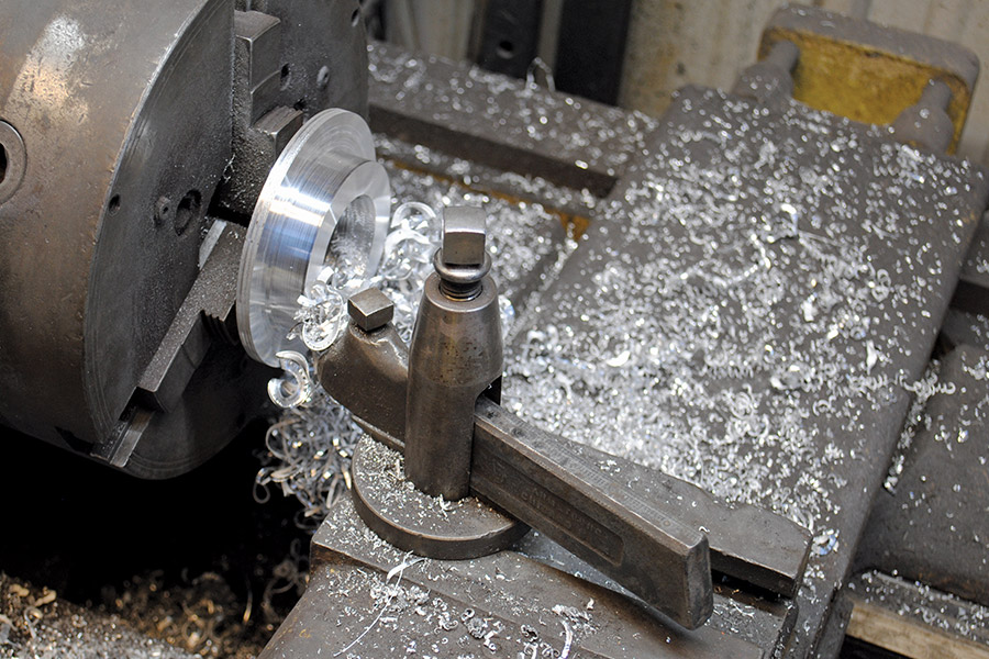 Metal shaving on a lathe, creating a custom part for a restoration project