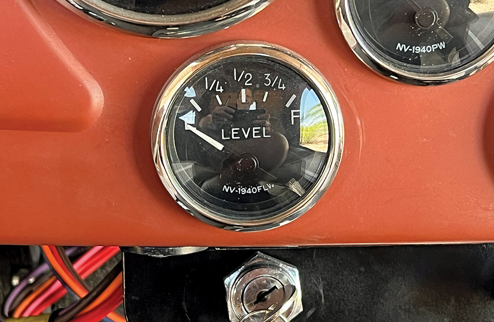Classic fuel gauge on a vehicle dashboard, indicating fuel level