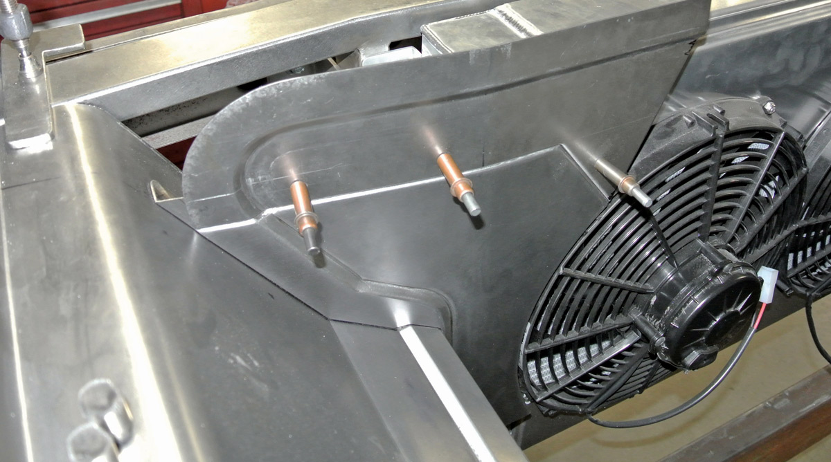 panel fitted into place near radiator fan