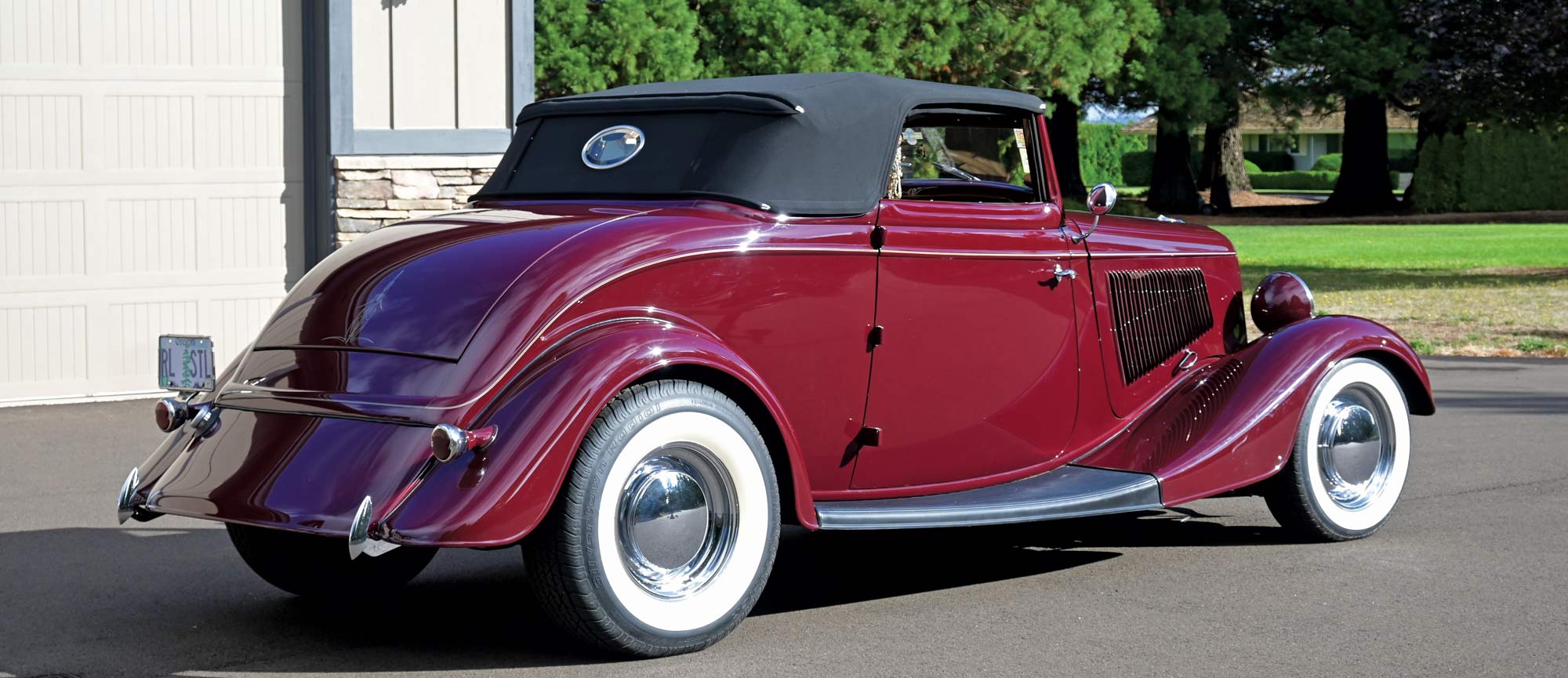 3/4 rear view of burgundy 1933 Ford Cabriolet