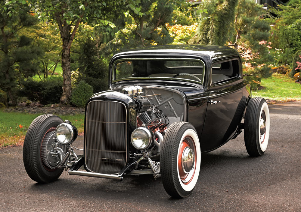 1932 Ford Coupe front view vertical grille exposed flathead engine and chrome accents classic design
