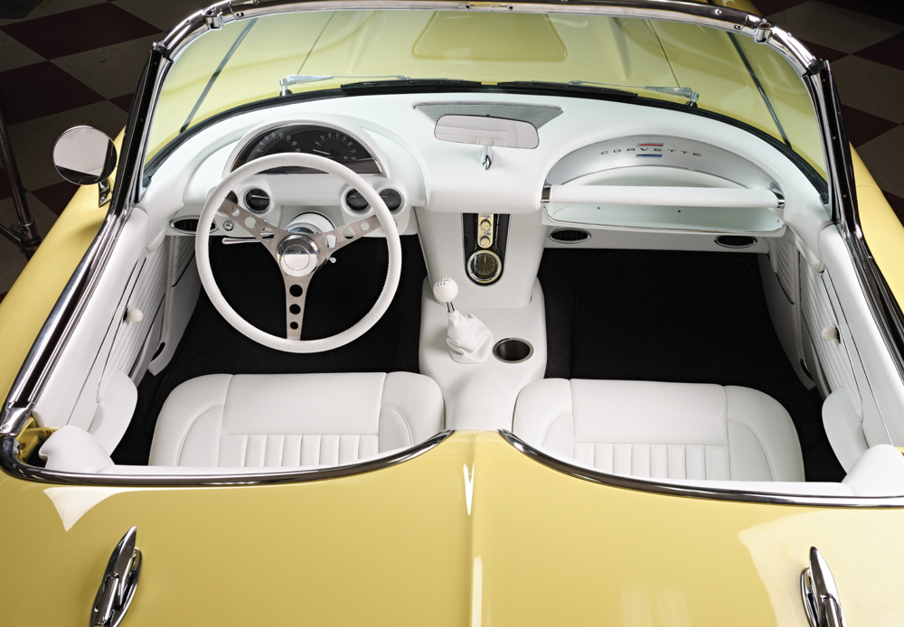Interior view 1961 Corvette yellow white upholstery classic dashboard design
