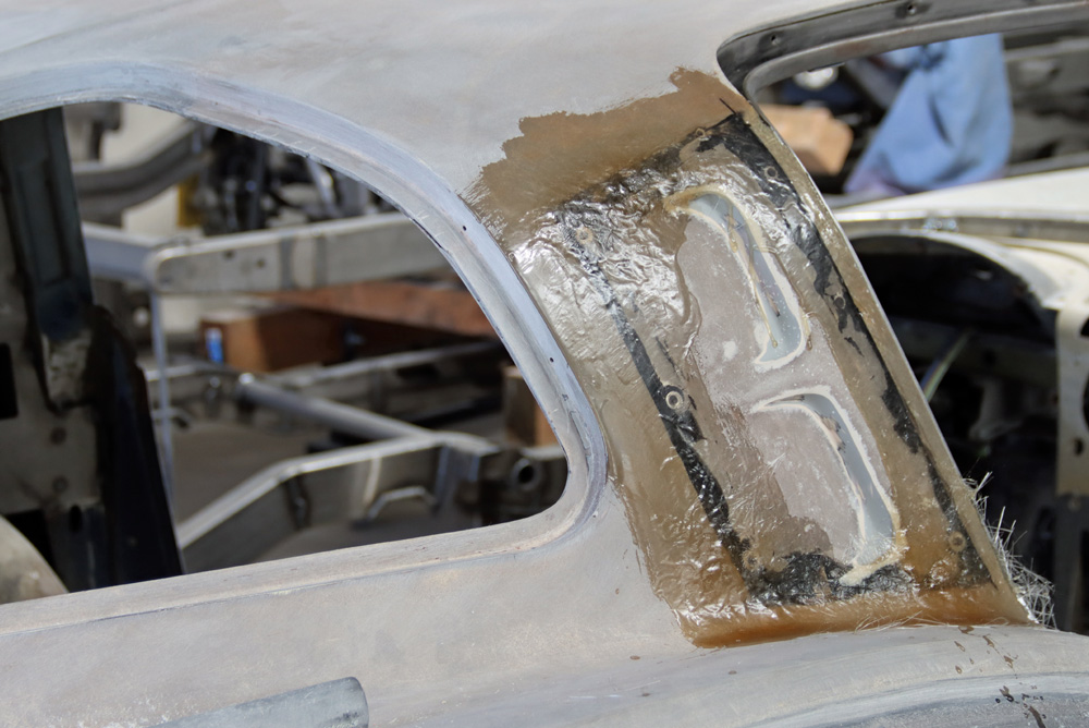 Custom fiberglass application on the C2 Corvette B-pillar for strength and seamless finish