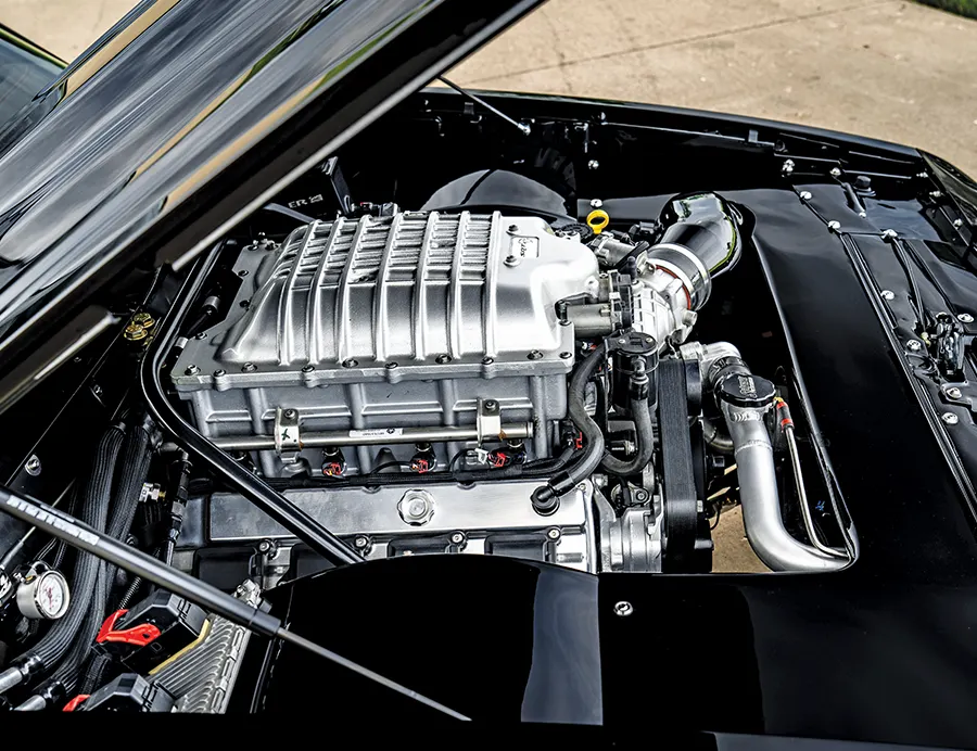 Supercharged engine bay 1985 Chevy Monte Carlo polished intake chrome components modernized muscle car performance