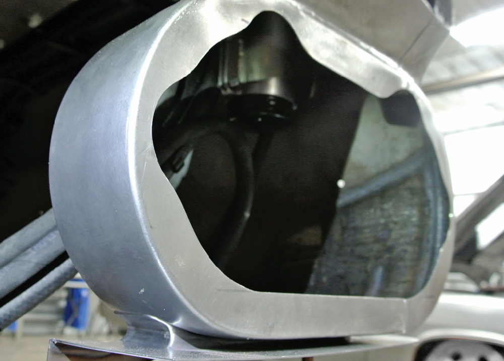 custom fabricated metal housing on a 1959 Chevy Impala, prepped for headlight assembly