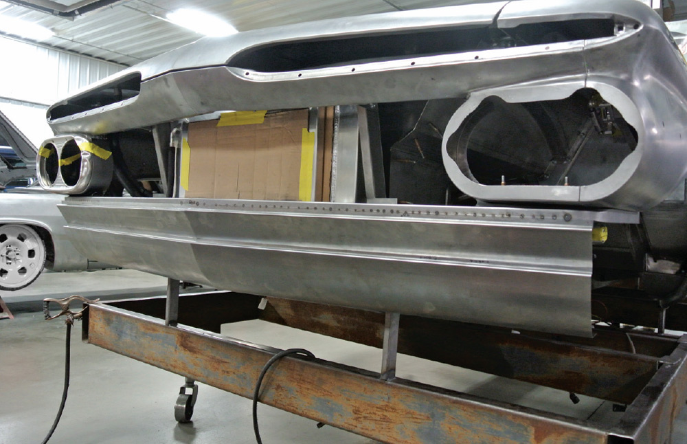 lower front bumper fabrication on a 1959 Chevy Impala, showing precise hand-formed panels