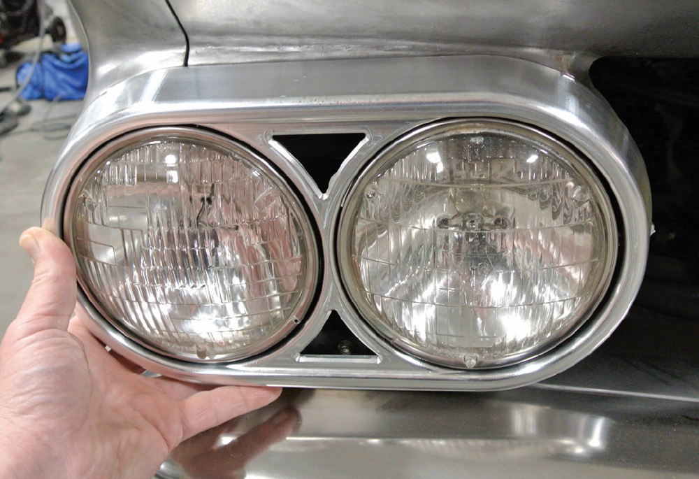 handcrafted dual headlight bezel installed on the 1959 Chevy Impala, showcasing custom metalwork