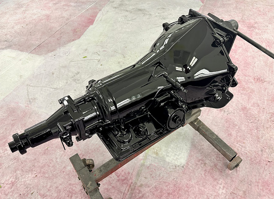 Completed black-painted transmission, ready for installation in the custom roadster