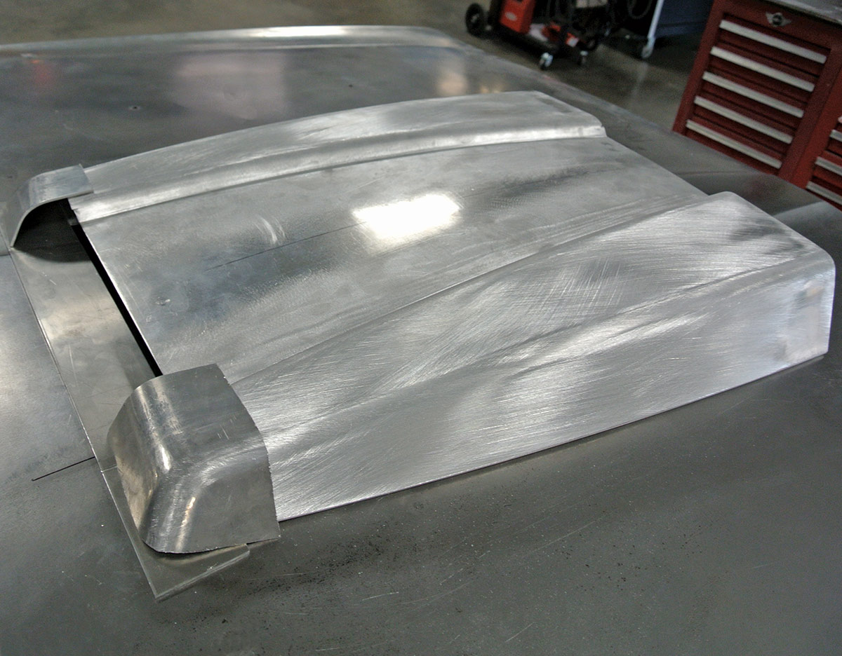 Brushed metal hood scoop design fitted on a custom project for added engine clearance and ventilation