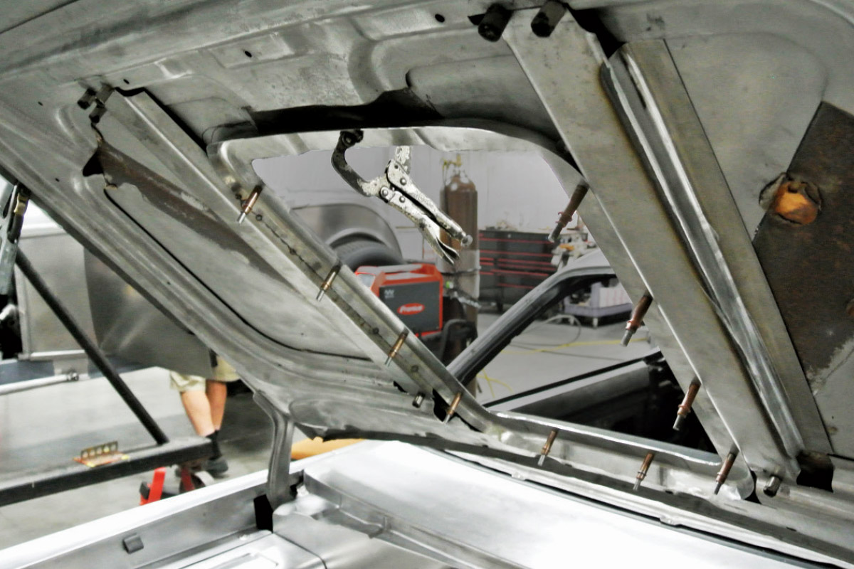 Underside view of the hood showing clamped structural support during fabrication for added rigidity