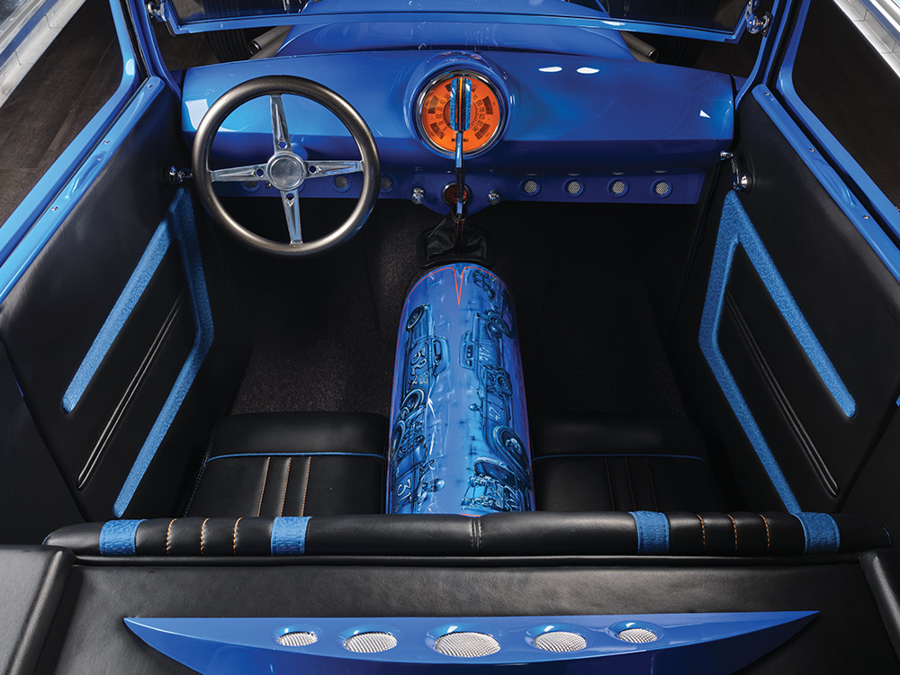1928 Ford Sedan interior showcasing blue dashboard, leather seats, and painted nitrous tank artwork