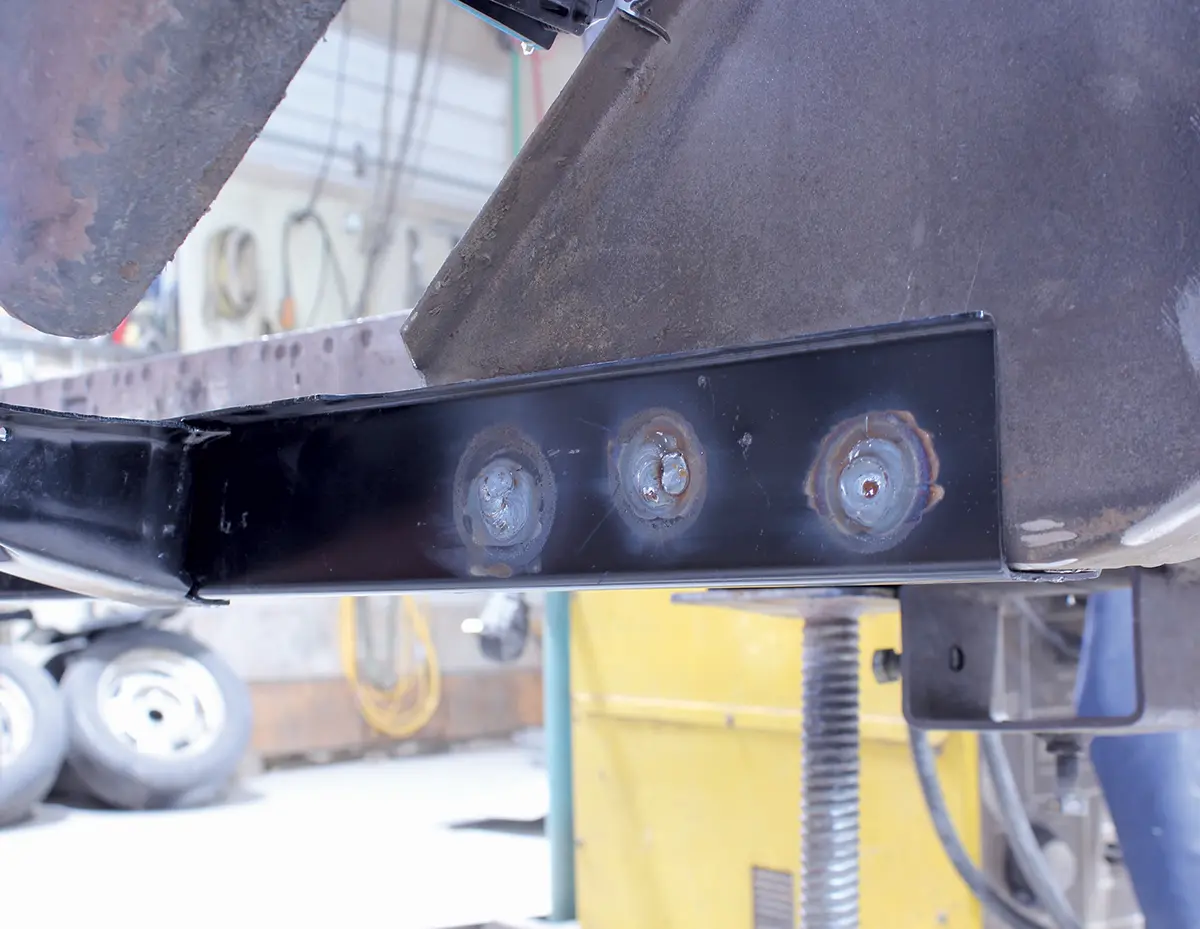 Installed replacement frame rail on 1965 Ford Mustang, secured with welds for structural integrity