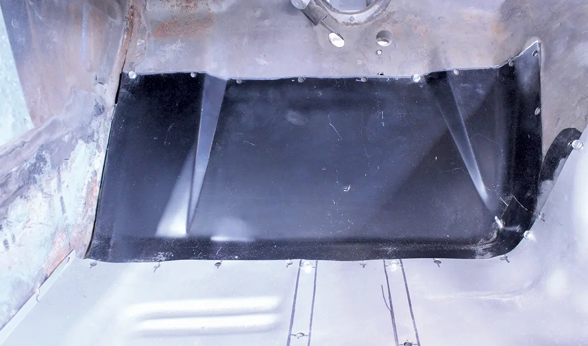 Detailed view of patch panel installation in the 1965 Ford Mustang firewall area