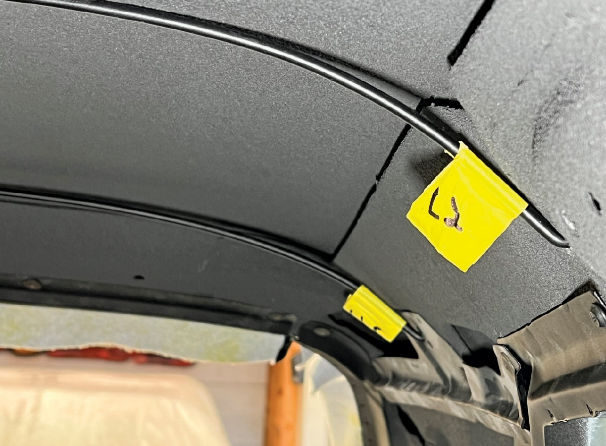 Interior roof structure of a 1970 Chevy Nova prepared for headliner installation