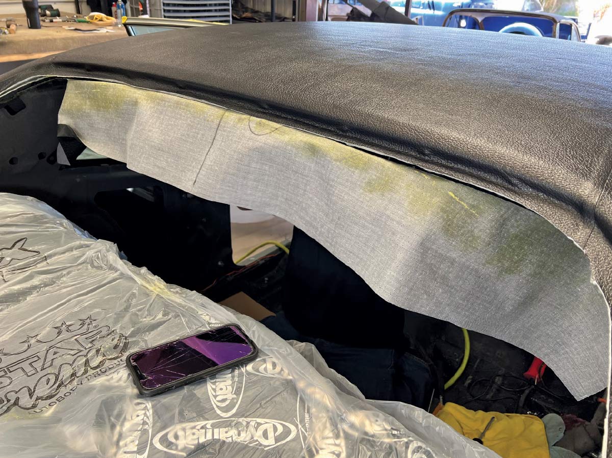 Partially installed headliner with exposed edges in a 1970 Chevy Nova