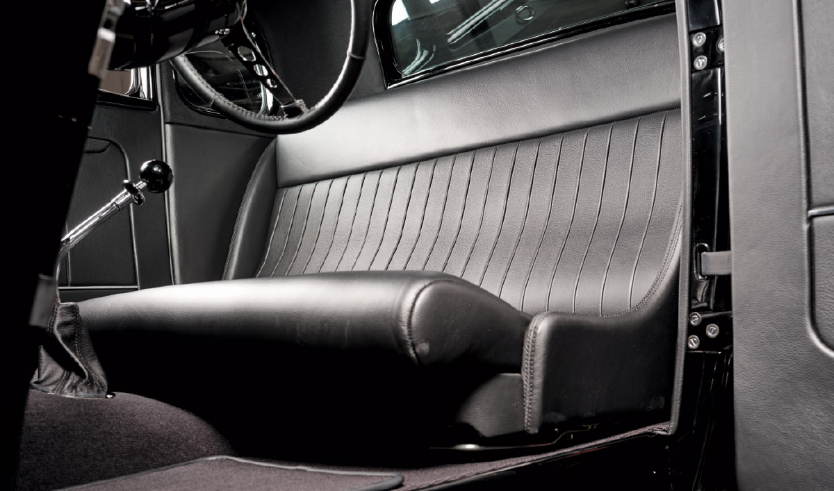 1933 Ford Five-Window Coupe interior showing a clean, simple seating arrangement with vintage-inspired upholstery