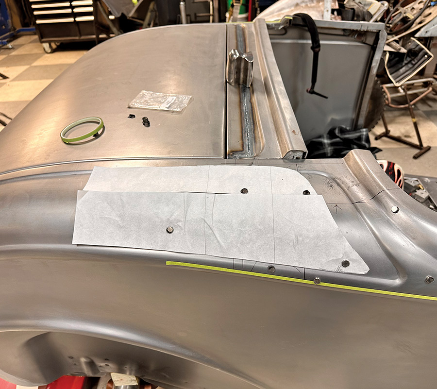 A template set on the rear quarter panel of a 1932 Ford Roadster, marking custom body modifications