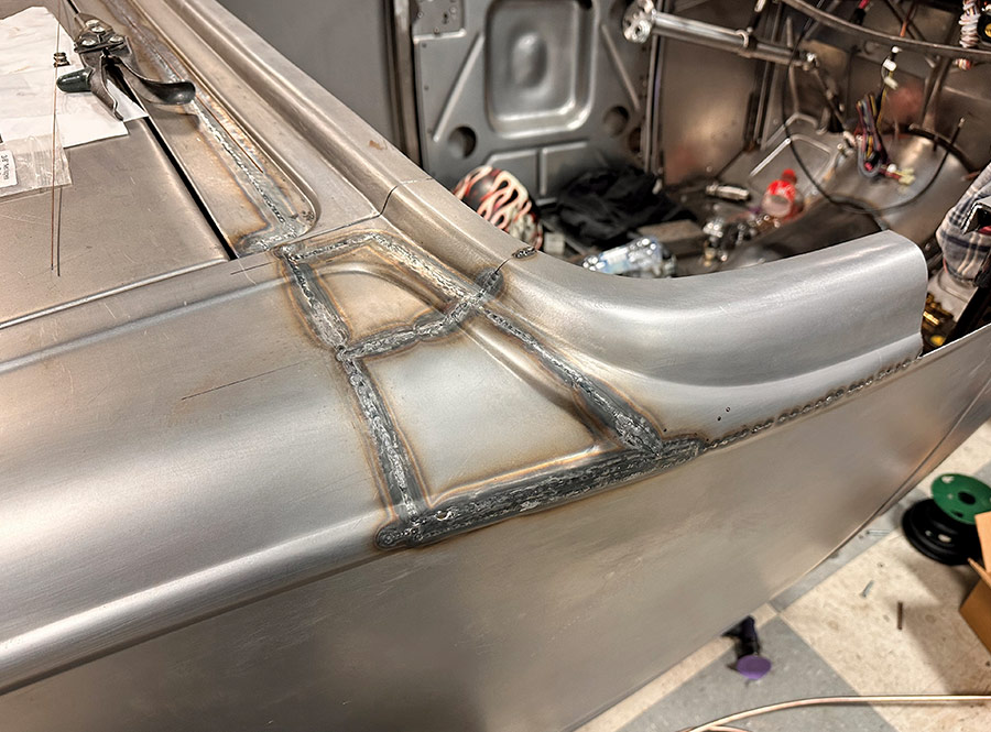 Metal finishing and structural reinforcement welded onto the rear section of a 1932 Ford Roadster