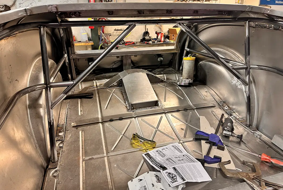 Rear chassis bracing inside a 1932 Ford Roadster, featuring custom tubing and panel reinforcement