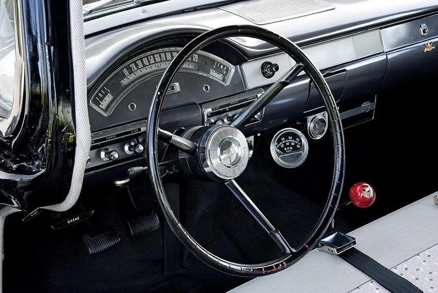 1957 Ford Custom steering wheel with a speedometer spanning the dash and a classic design