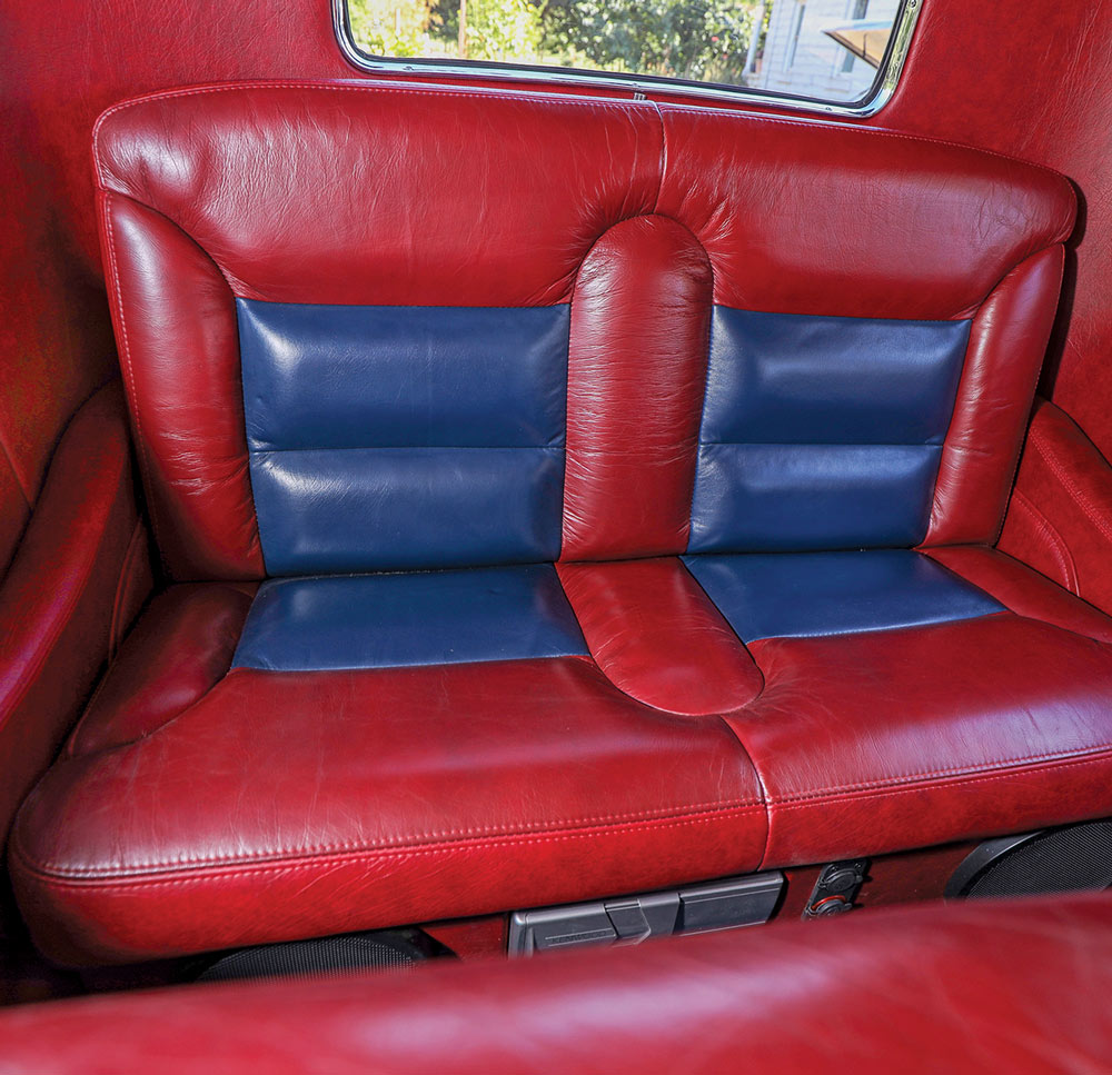 1932 Ford Tudor rear seat in matching red and blue leather upholstery