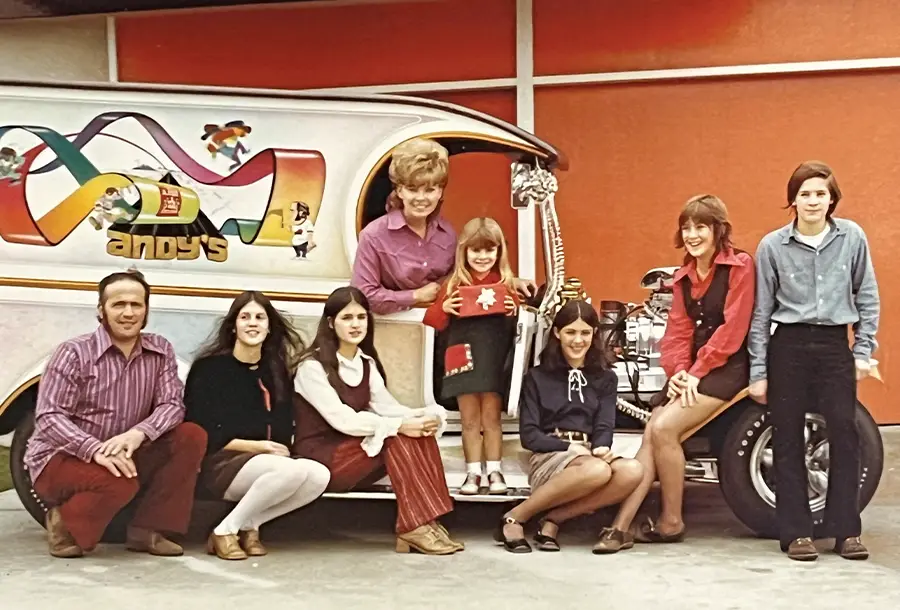 Brizio family posing in front of the C-Cab