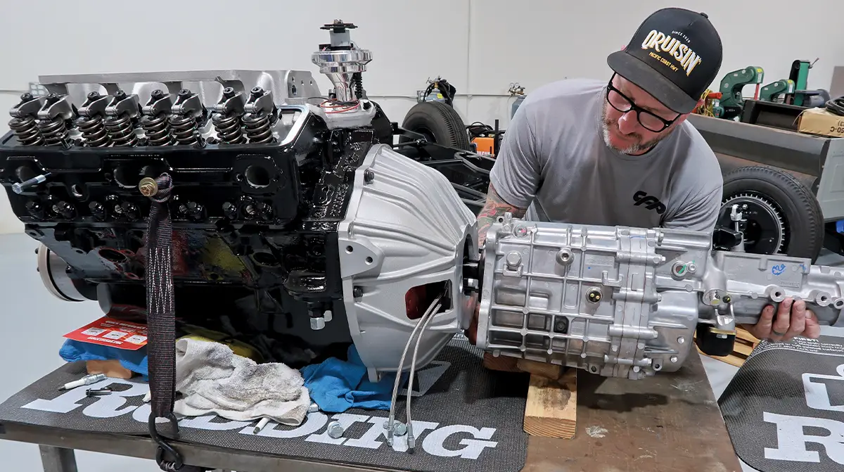 Jason Scudellari of HB Hot Rod attaches a TREMEC TKX five-speed transmission to a small-block Chevy
