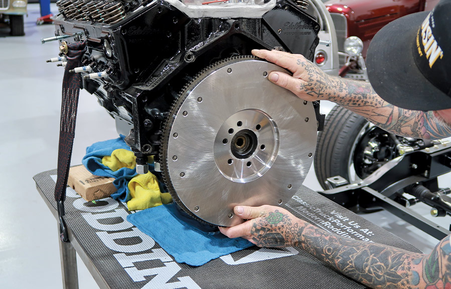Summit billet steel flywheel being installed in the crankshaft