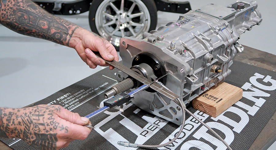 person checking the Initial measurement of the throwout bearing