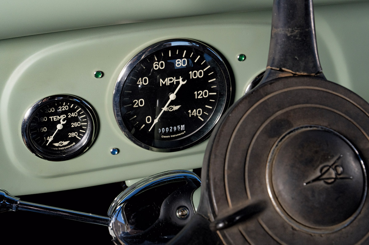 dashboard and steering wheel of sage green 1936 ford pickup truck
