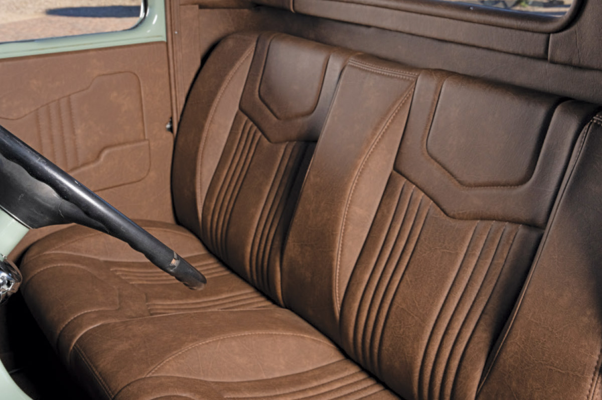 brown leather seats inside sage green 1936 ford pickup truck