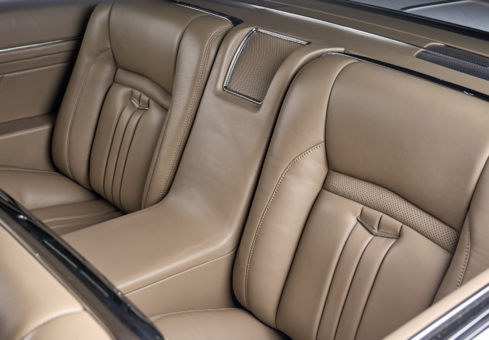 Detailed rear seat view of 1959 Impala highlighting plush tan leather and precision custom upholstery